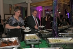 People at food buffet at Mardi Gras for AIM Services