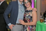 Couple smiling at Mardi Gras event for AIM Services
