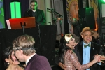 Shot of two couples dancing at Mardi Gras event for AIM Services