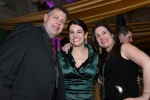 Three people smiling at Mardi Gras event for AIM Services