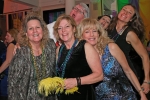 People laughing and making funny faces at Mardi Gras event for AIM Services
