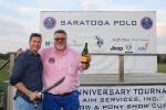 Two men with sabored champagne bottle and sword at the Saratoga Dog & Pony Show to benefit AIM Services, Inc.