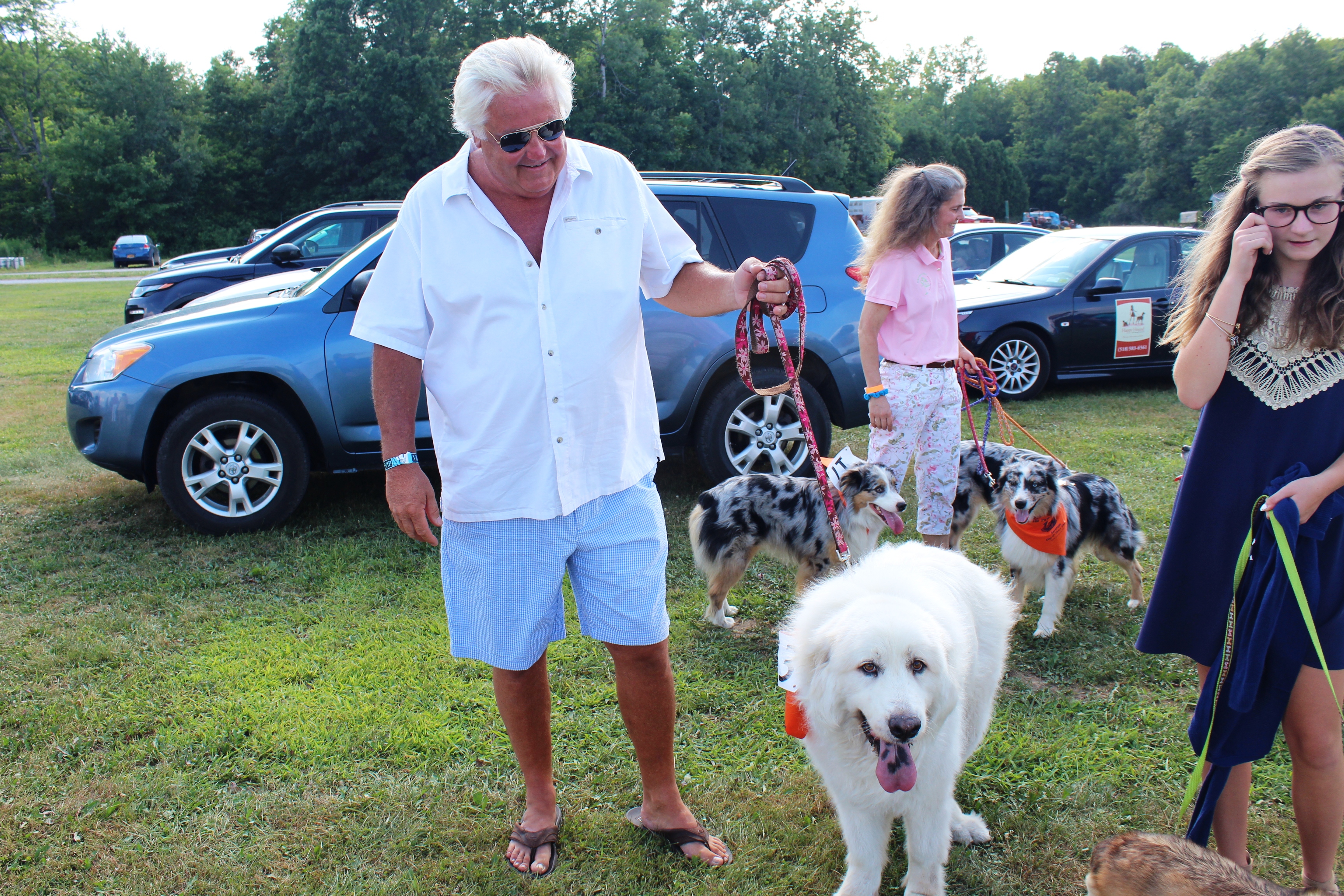 Man with big dog at the Saratoga Dog's Pony Show to benefit AIM Services, Inc.