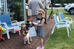 Young girl with small dog winning prize at the Saratoga Dogs Pony Show to benefit AIM Services, Inc.