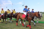 Polo players on horses at the Saratoga Dogs Pony Show to benefit AIM Services, Inc.
