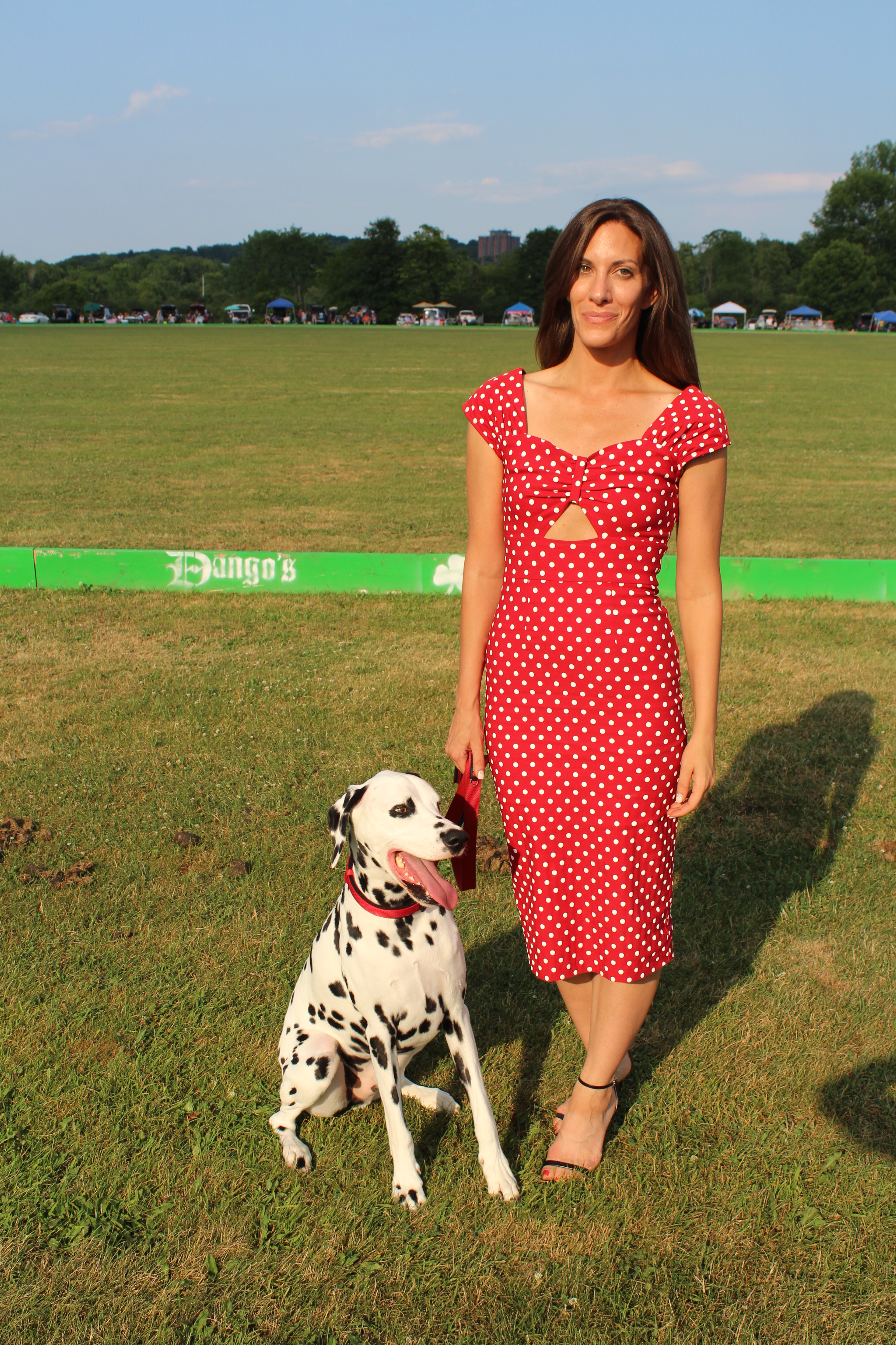 Woman in polka dot dress with dalmation at the Saratoga Dogs Pony Show to benefit AIM Services, Inc.