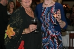 Vin Le Soir to benefit AIM Services, Inc. two women with wine at the event