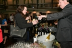 Vin Le Soir to benefit AIM Services, Inc. woman being poured wine from specialty wines and more