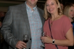 Vin Le Soir to benefit AIM Services, Inc. couple at event with wine