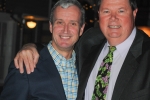 Two men smile for photo at Vin Le Soir to benefit AIM Services, Inc.