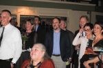 Vin Le Soir to benefit AIM Services, Inc. group of people watching speaker