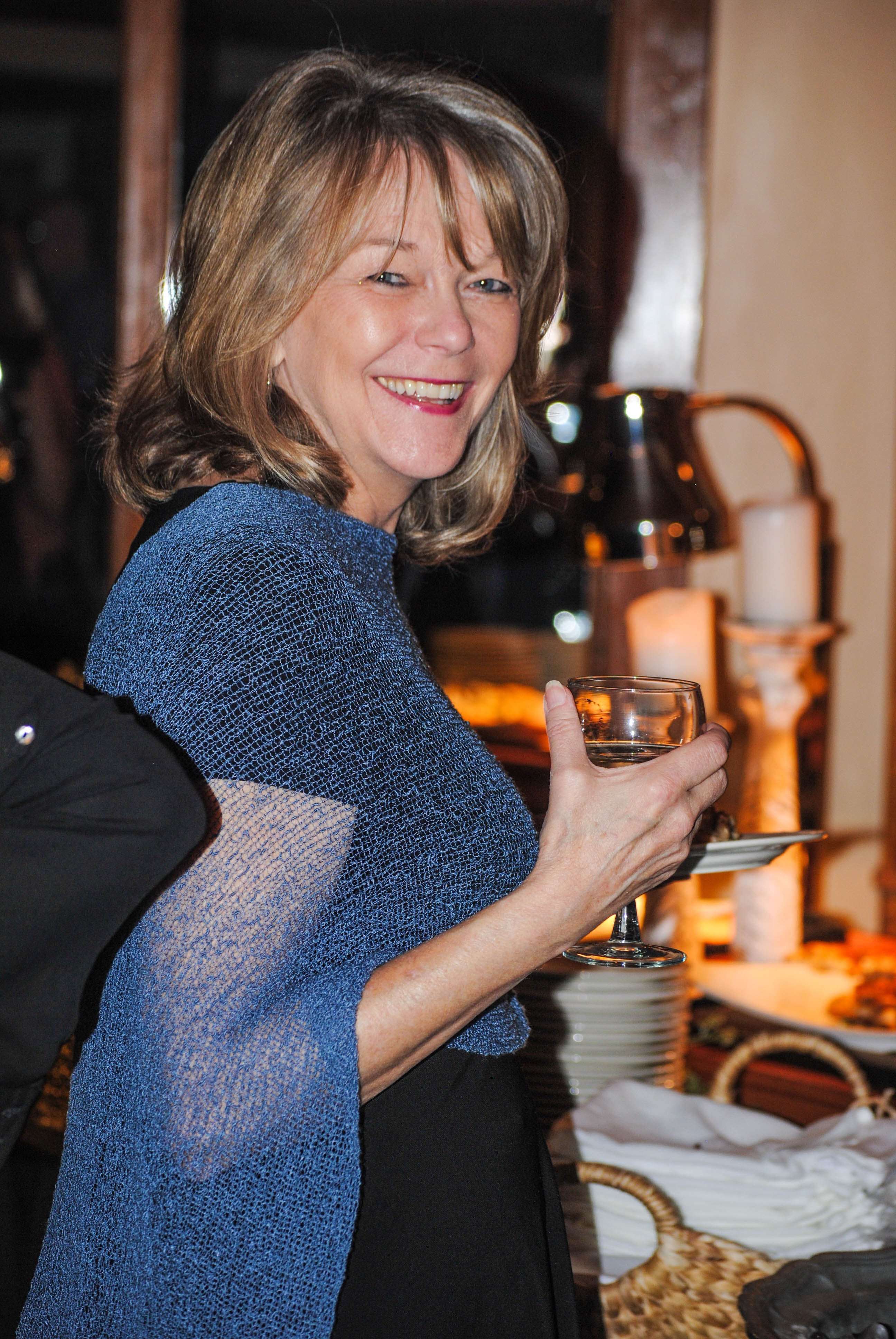 Vin Le Soir to benefit AIM Services, Inc. woman with glass of wine