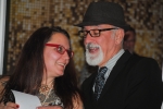 Vin Le Soir to benefit AIM Services, Inc. couple looking at photo booth picture