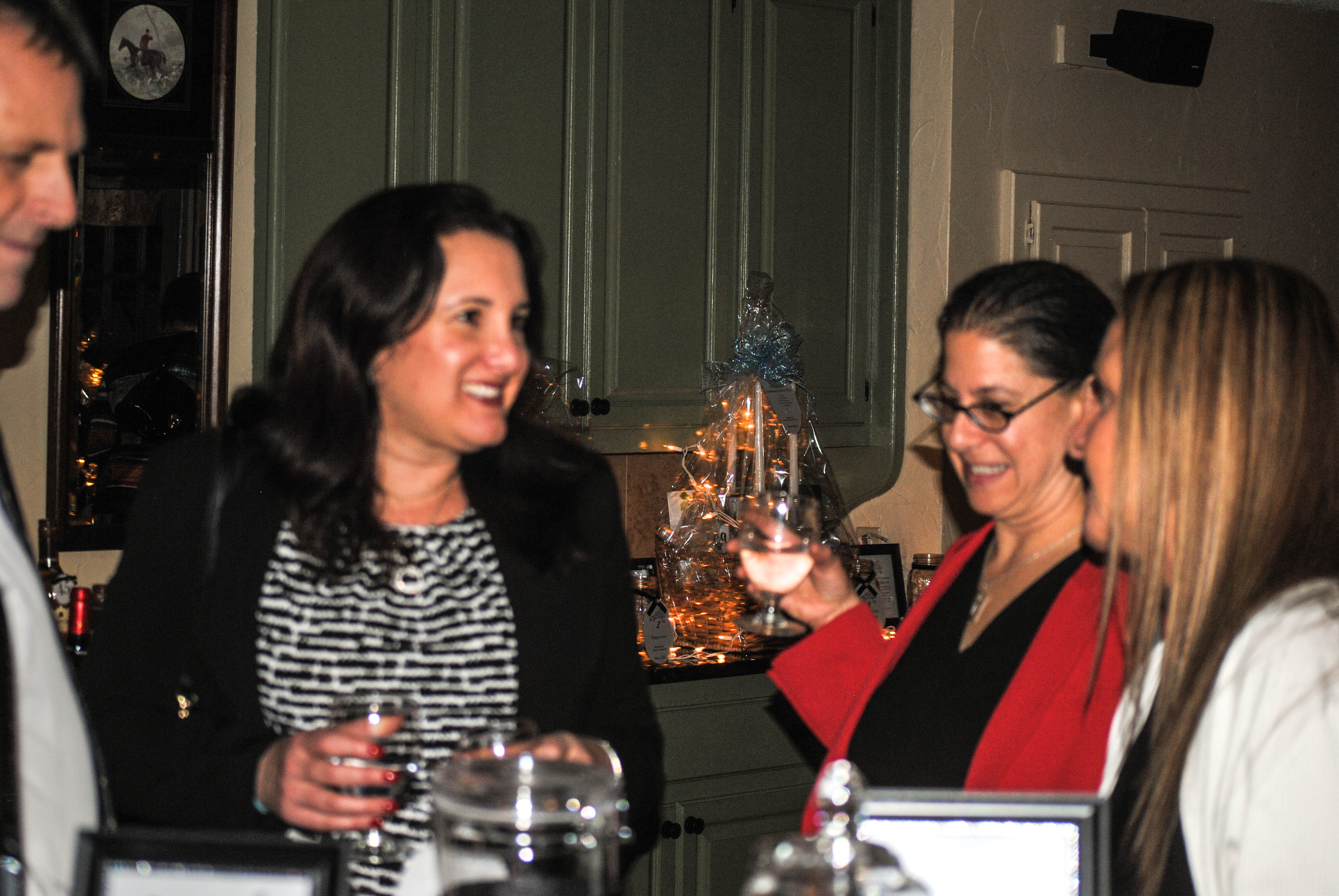 Vin Le Soir to benefit AIM Services, Inc. group of people at table