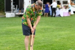 Gary Dake swinging mallet at AIM Services Croquet on the Green event