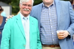 Two men in bright blazers at AIM services croquet on the green event