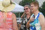 June MacClelland and friends laughing together at AIM Services Croquet on the Green event
