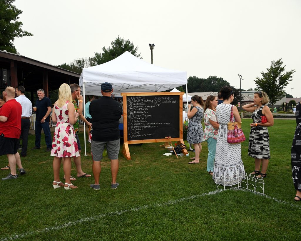 People mingling at AIM Services Croquet on the Green event