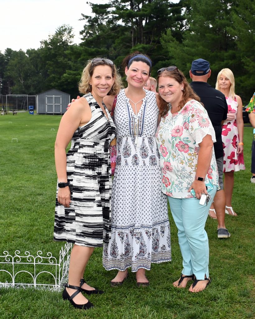 Group of three women at AIM Services Croquet on the Green event