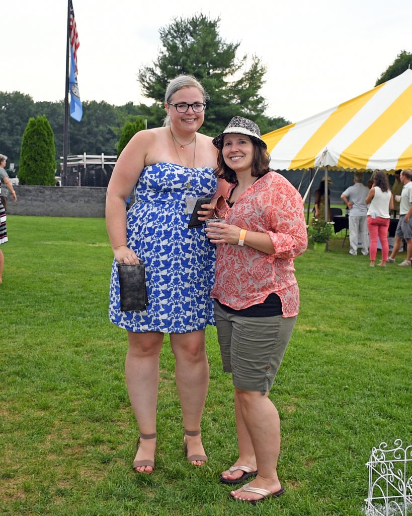 Two woman at AIM Services Croquet on the Green event