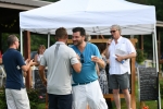 Two men shaking hands at AIM Services Croquet on the Green event