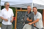 Croquet winners, father and son, pose with mallets at AIM Services Croquet on the Green event