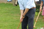 Man posing with croquet mallet at AIM Services Croquet on the Green event