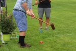 Damon Casey practicing his swing at AIM Services Croquet on the Green event