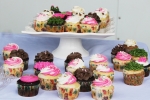 Pink, white, and green frosted cupcakes at AIM Services Croquet on the Green event