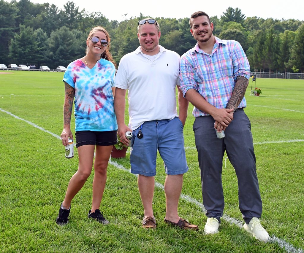 Group of three people smiling at Croquet on the Green 2019