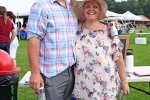 Man and woman holding beers and smiling together at Croquet on the Green 2019