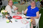 Two women sitting at a table at Croquet on the Green 2019