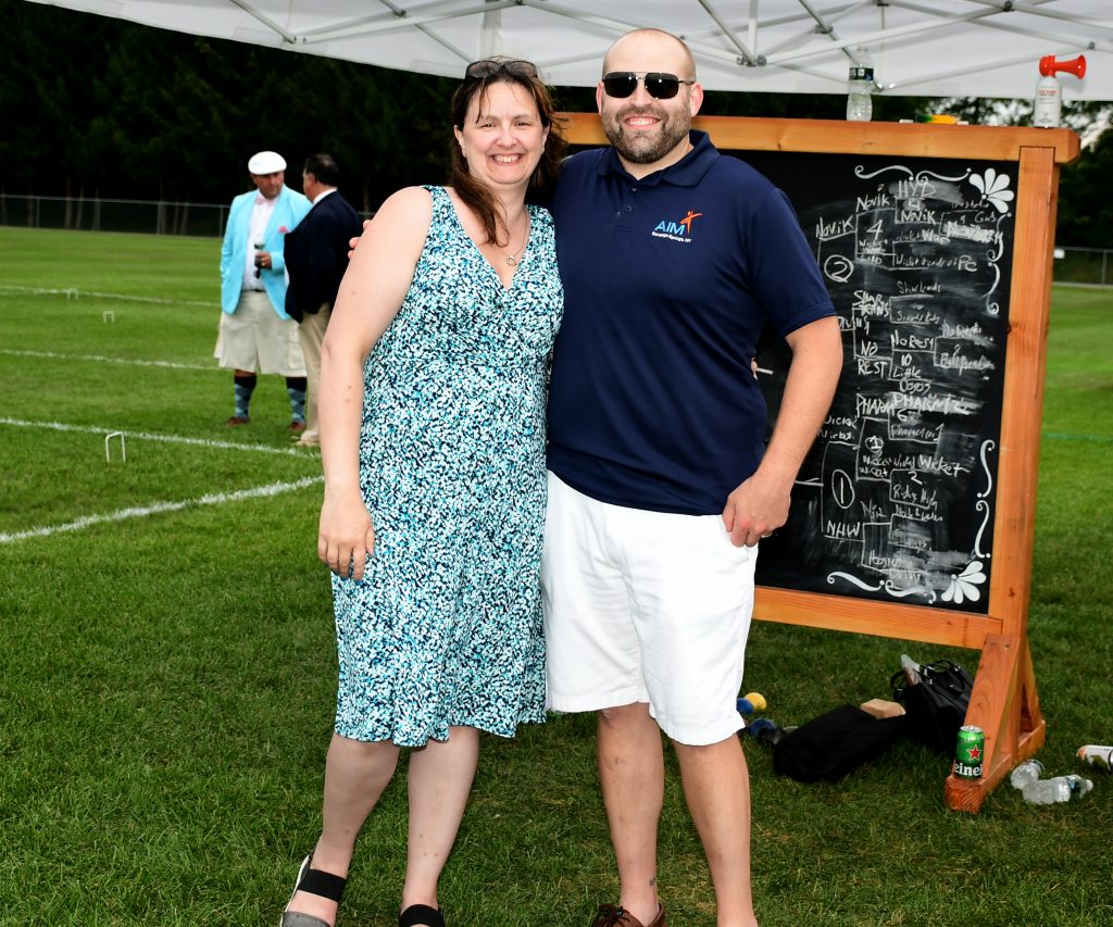 Carrie Locke and Josh Phelps smiling together at Croquet on the Green 2019