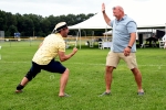 Two men excitedly lining up a high five at Croquet on the Green 2019