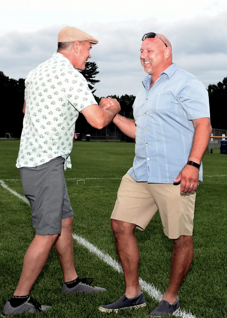 Two men shaking hands and smiling at Croquet on the Green 2019