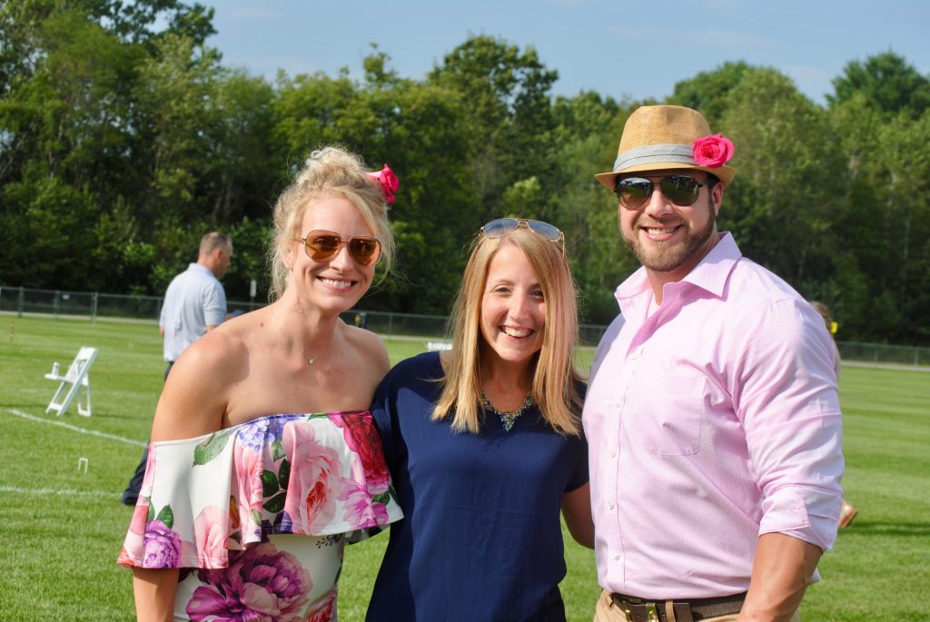 Group of three people smiling at Croquet on the Green 2019