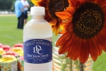 DeCrescente water bottle next to a bouquet of sunflowers at Croquet on the Green 2019