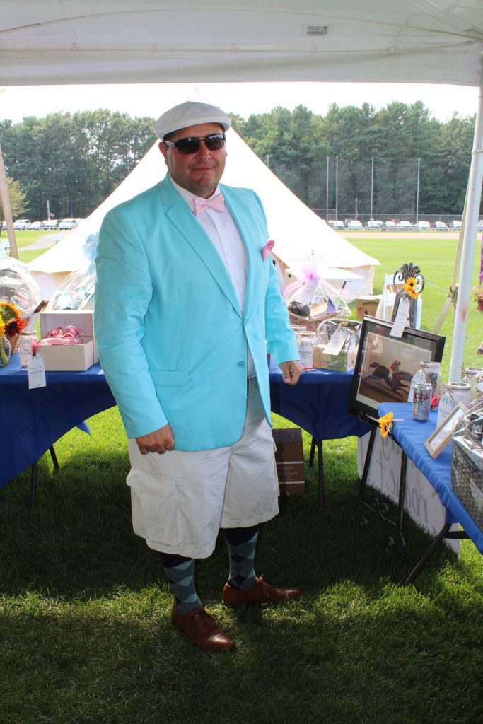 man in teal jacket and white hat dressed up at Croquet on the Green 2019