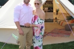 Couple in pink matching outfits in front of glamp tent at Croquet on the Green 2019
