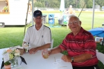 Board member Bob Ricketts with friend at table at Croquet on the Green 2019