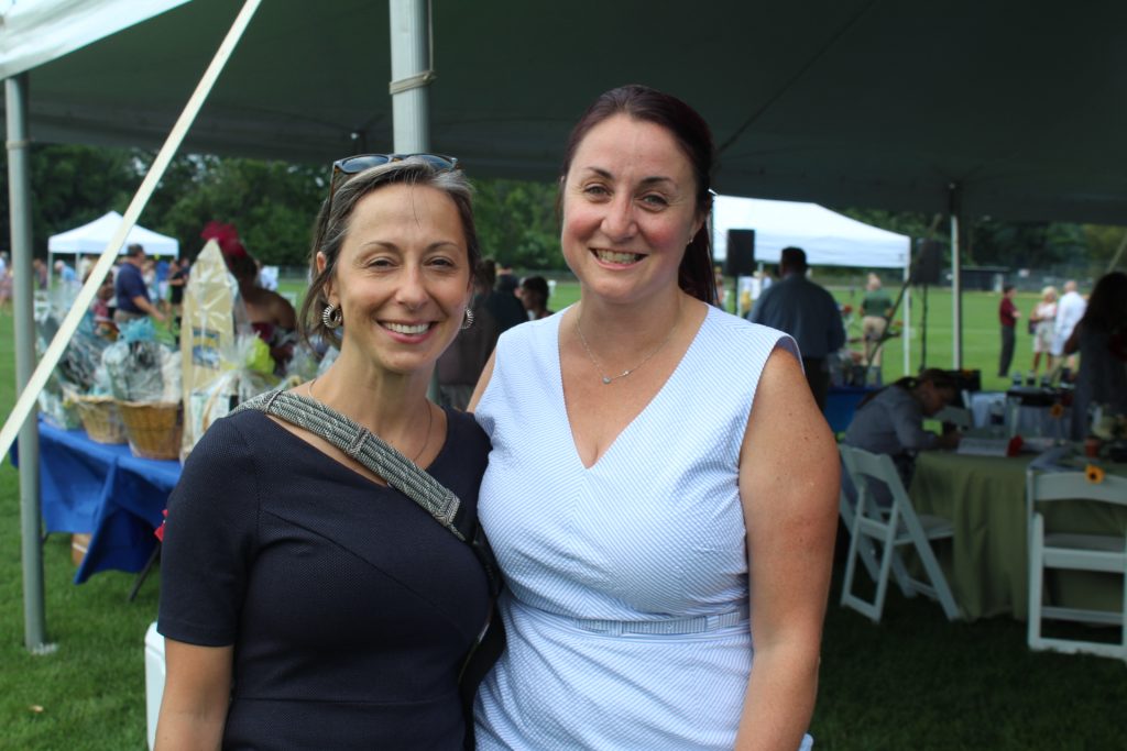 Bo Goliber of Fingerpaint and Tara Anne Pleat of Wilcenski & Pleat PLLC smiling together at Croquet on the Green 2019