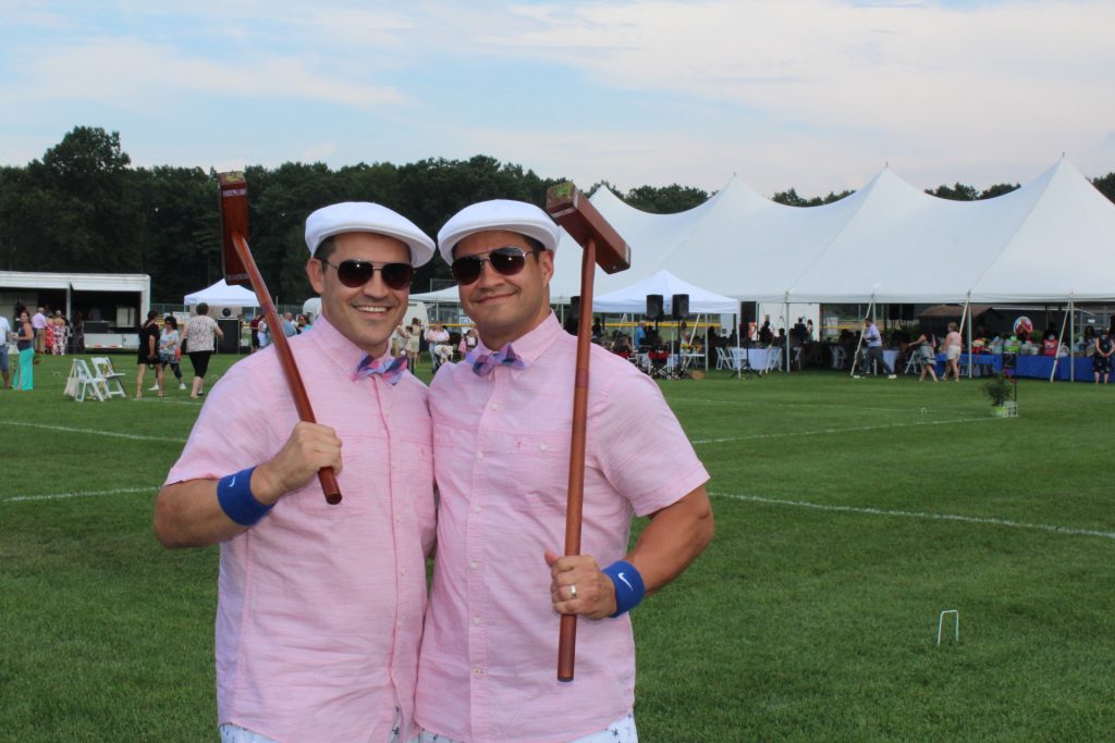 Two men in matching croquet outfits at Croquet on the Green 2019