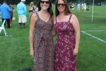 Two women in floral maxi dresses smiling at Croquet on the Green 2019