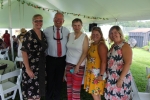 Tom Flynn of Jaeger & Flynn with four other AIM staff members in bright colored clothing at Croquet on the Green 2019