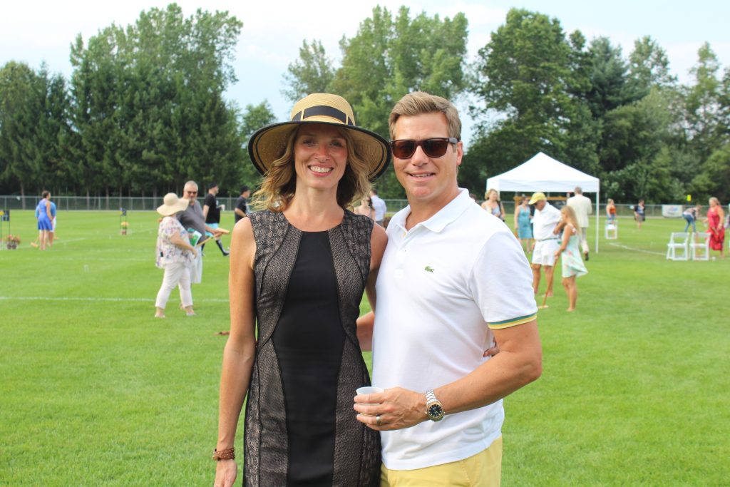 Couple smiling on croquet field at Croquet on the Green 2019