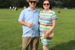 Couple holding beers on croquet field at Croquet on the Green 2019