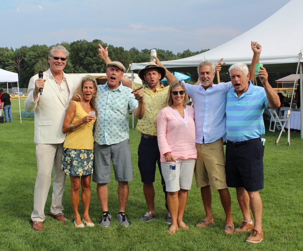 Group of seven people cheering at Croquet on the Green 2019