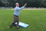 Man throwing bag for cornhole at Croquet on the Green 2019