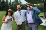 Group of three people with goofy glasses and a sign from the photo booth at Croquet on the Green 2019