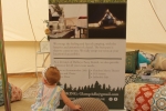 GlampADK sign with a baby standing in front at Croquet on the Green 2019